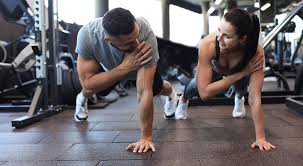 Image of man and woman doing Cardio Poole to tone their arms. 